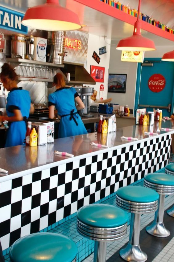 Nostalgic Mid-Century Diner Cafe Design with Vibrant Colors and Open Kitchen Concept