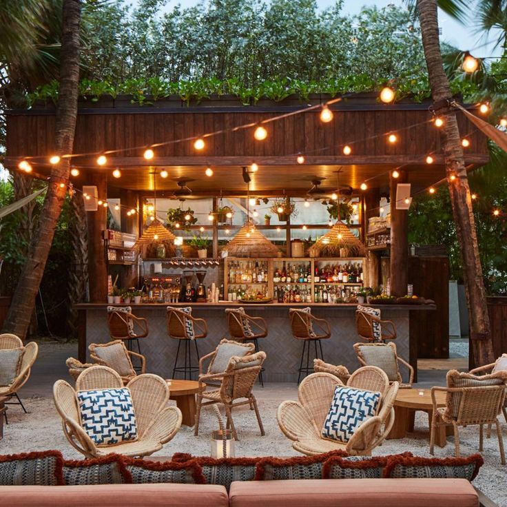 Charming Tropical Cafe Design with Inviting Outdoor Bar and Cozy Ambiance