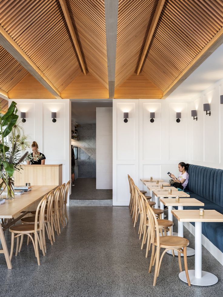 Modern Cafe Design: Spacious, Inviting Atmosphere with Minimalist Aesthetic and Community Focus