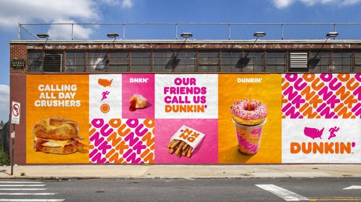 Vibrant Mural Transforms Cafe's Exterior into a Striking Urban Landmark