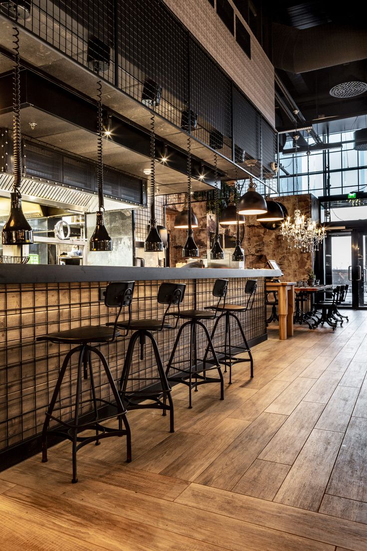 Contemporary Industrial Cafe Design: Harmonious Blend of Raw Materials and Warm Elements