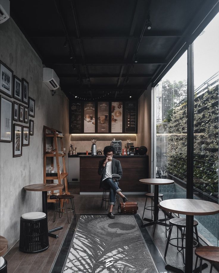 Modern Minimalist Cafe Blends Industrial and Cozy Elements for an Inviting Atmosphere