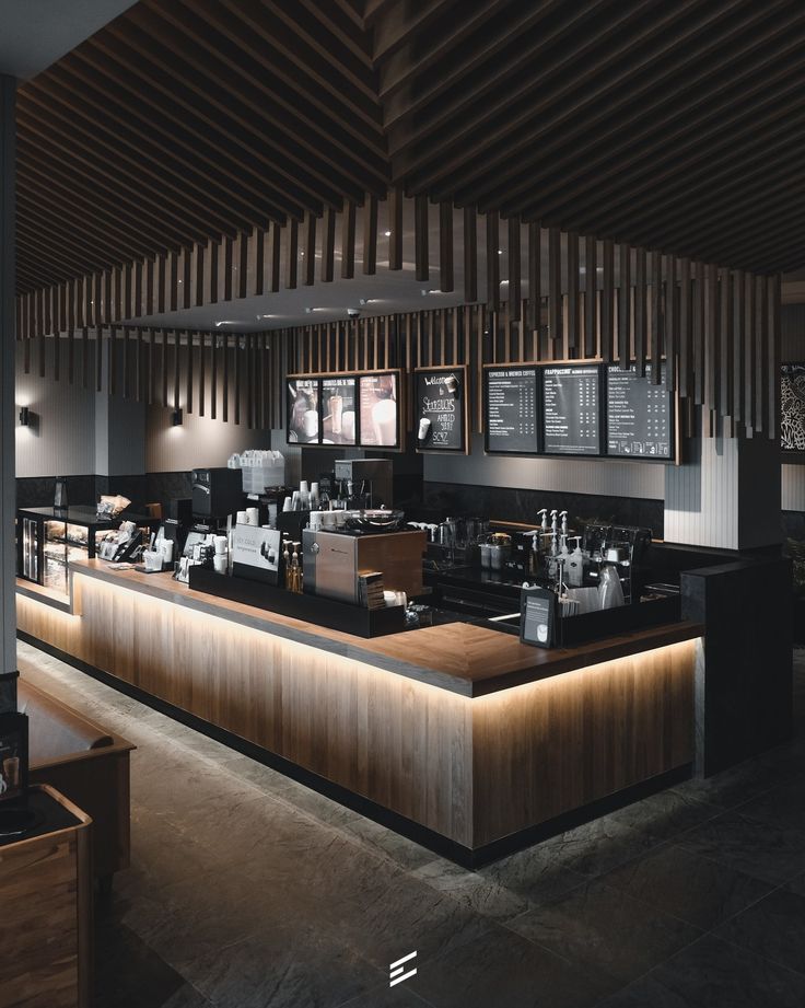 Inviting Cafe Design: A Sleek, Modern Aesthetic with Warm Wood and Elegant Lighting