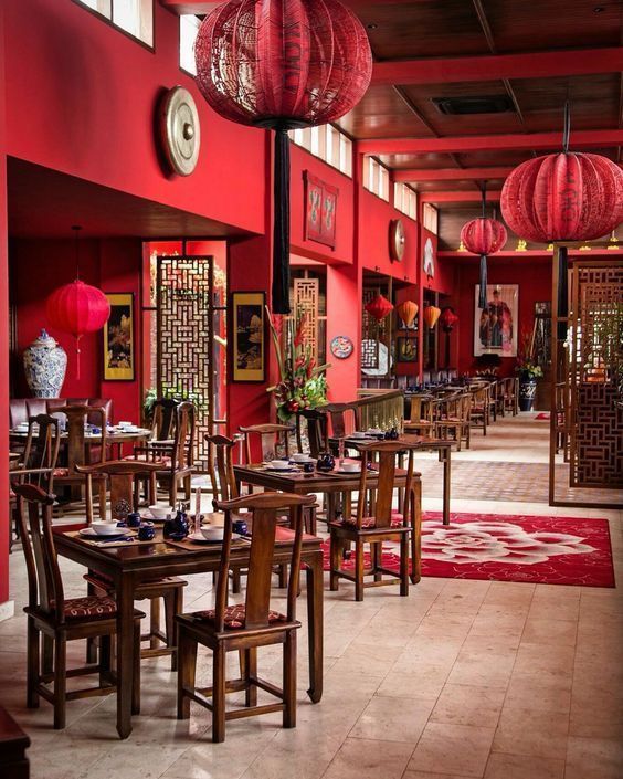 Inviting Cafe Design with Warm Color Palette and Cultural Ambiance