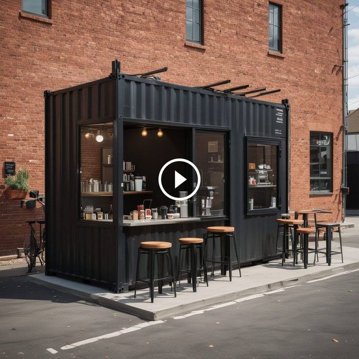 Modern Industrial Cafe Design Showcasing a Repurposed Shipping Container with Sleek Aesthetics and Urban Outdoor Seating