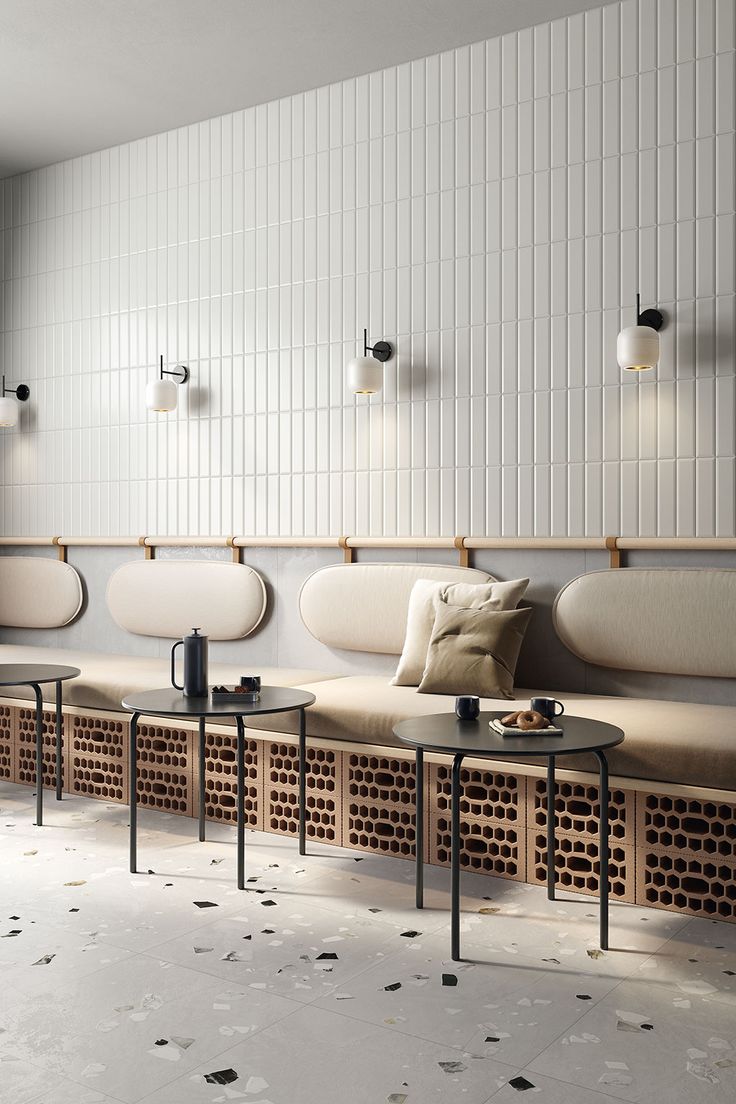 Harmonious Modern Elegance: A Cozy Cafe Design with Textured Walls and Sophisticated Lighting