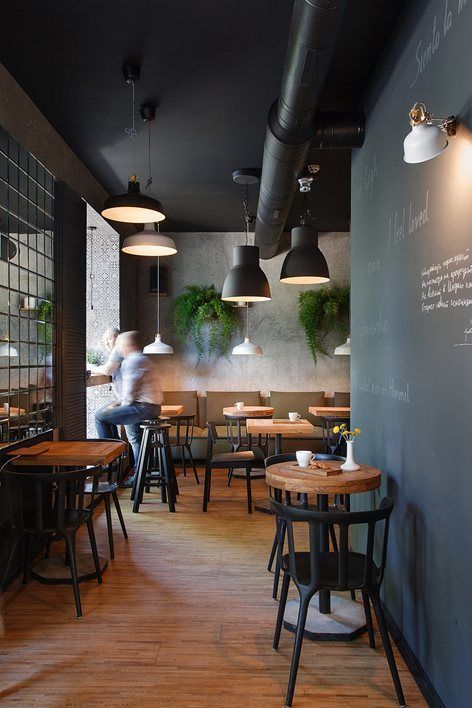 Modern Minimalist Cafe Design: A Cozy and Inviting Atmosphere with Natural Wood and Greenery