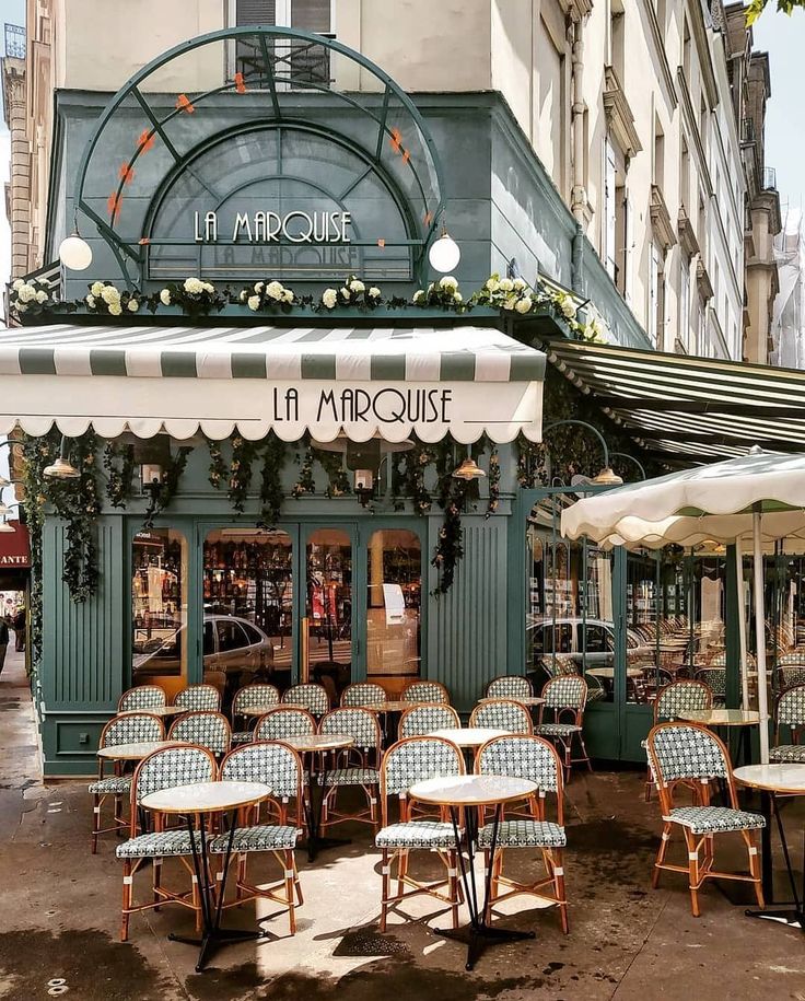 Charming Cafe Design: Elegant Green Facade with Inviting Outdoor Seating and Welcoming Interior