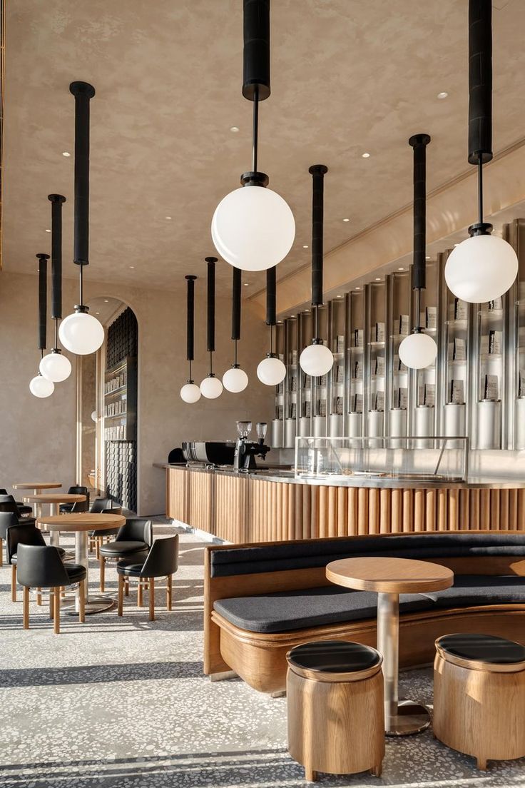 Modern Cafe Design: Inviting Atmosphere with Minimalistic Aesthetic and Community Focus