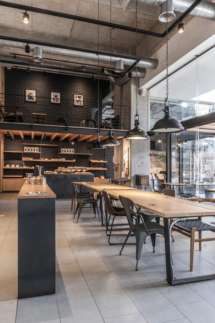 Modern Industrial Cafe: A Cozy Space of Concrete, Wood, and Natural Light