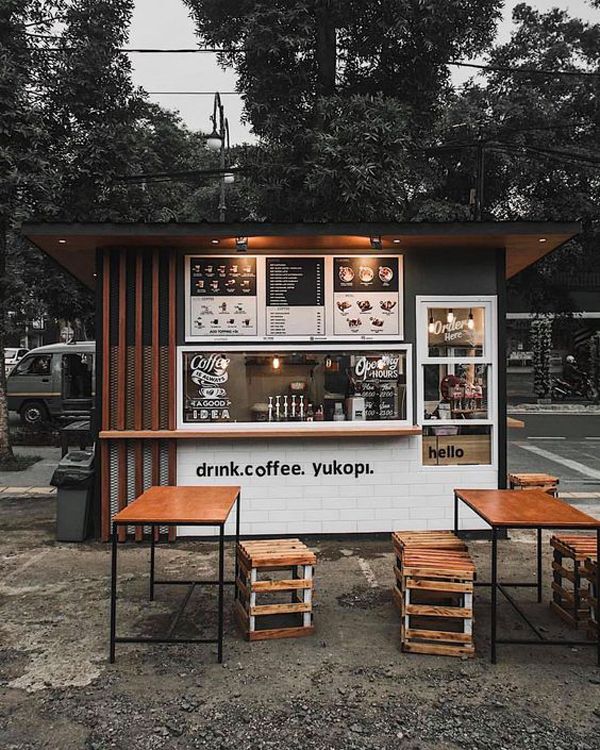 Modern Minimalist Cafe Design Enhances Engagement with Inviting Aesthetics and Functional Outdoor Space