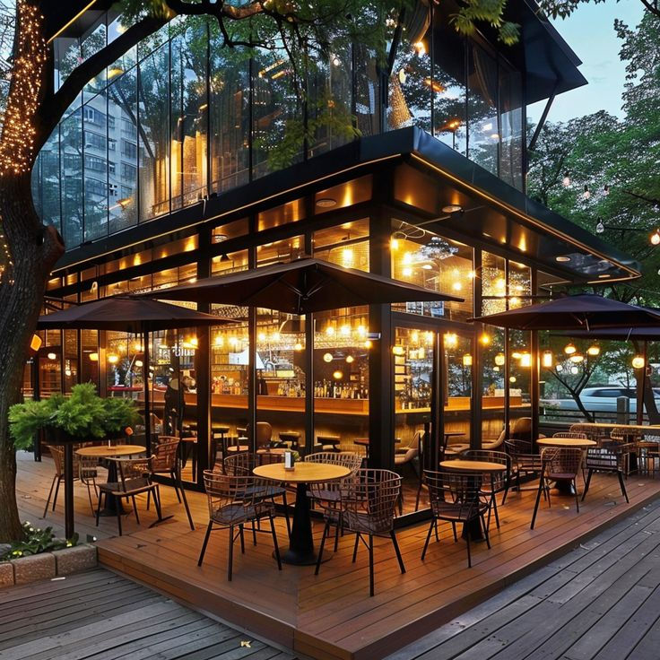 Modern Cafe Design: A Sleek, Inviting Space with Natural Light and Cozy Outdoor Seating