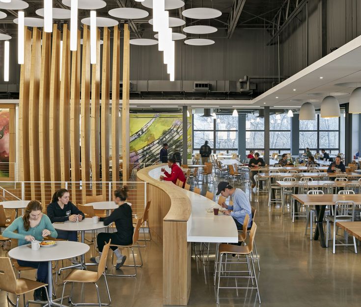 Inviting Cafe Design: A Spacious Layout with Natural Light, Warm Wood Elements, and Cozy Ambiance