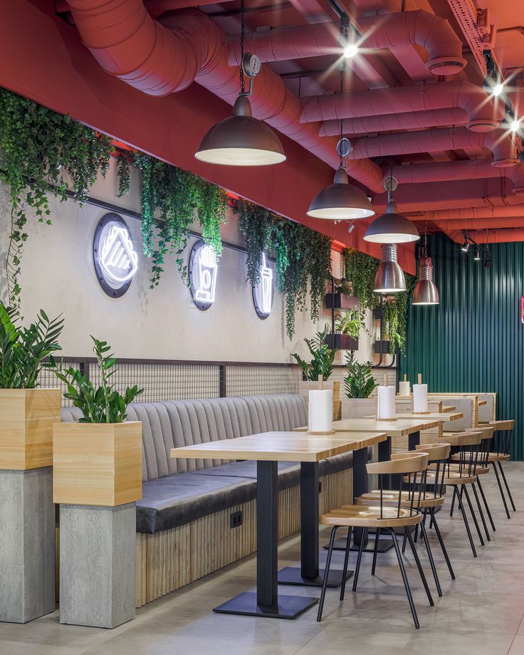 Contemporary Cafe Design Combining Sleek Materials, Vibrant Colors, and Natural Elements for an Inviting Atmosphere