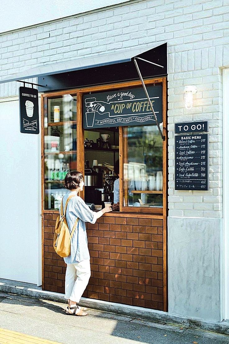 Charming Cafe Design: Warm Wood Framed Take-Out Window Enhances Casual Atmosphere for Quick Coffee Lovers