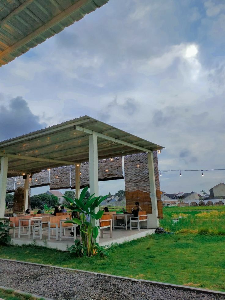 Nature-Inspired Open-Air Cafe Design with Rustic Modern Aesthetics and Social Seating