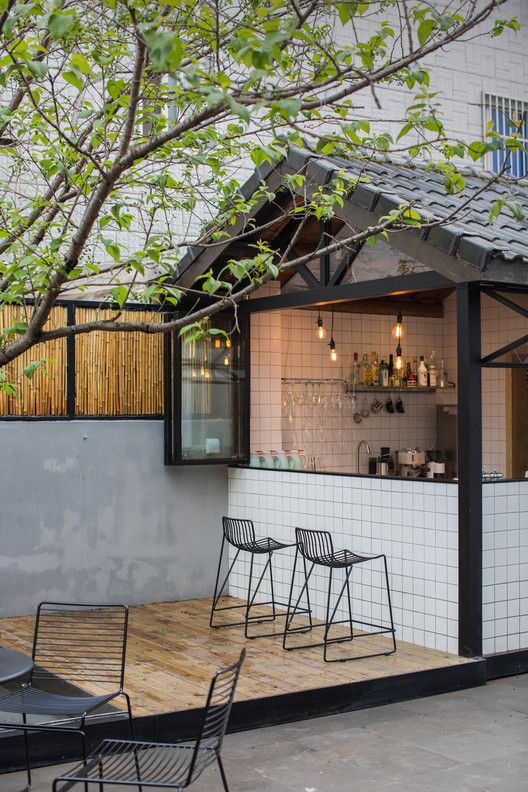 Modern Cafe Design with Inviting Outdoor Space and Cozy Atmosphere