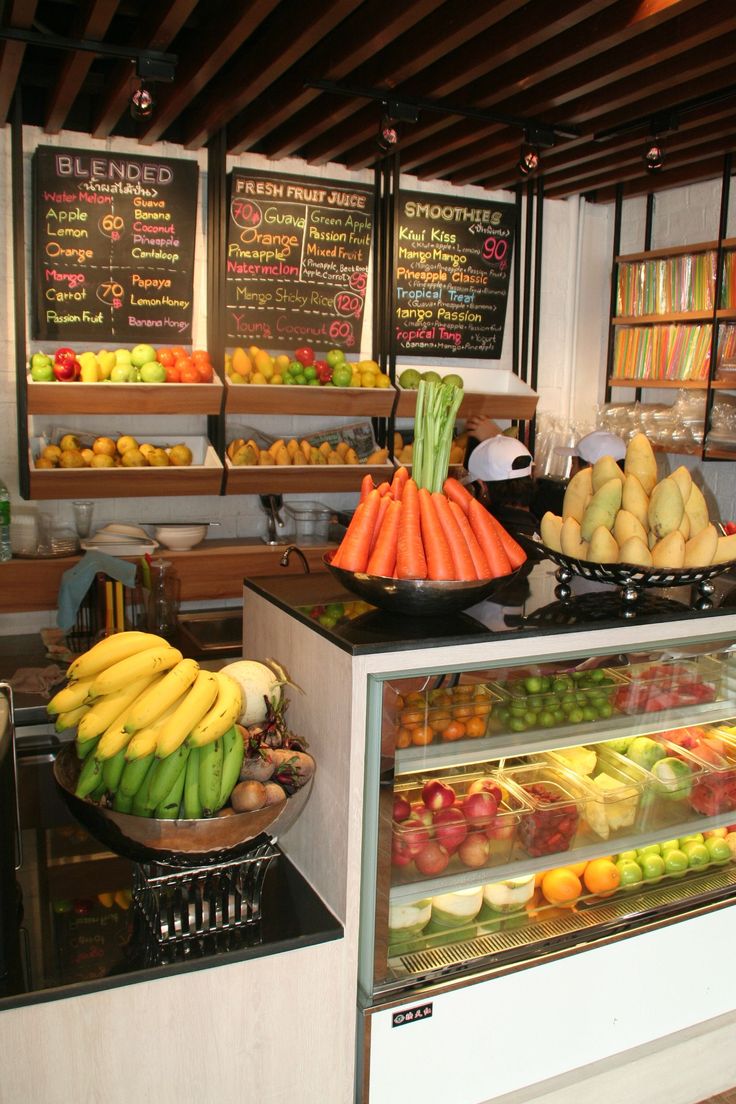 Inviting Cafe With Lively Fresh Produce Displays and Cozy Ambiance