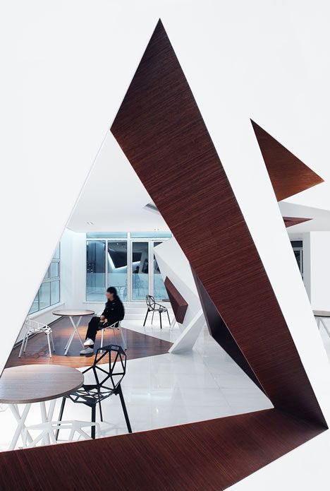 Contemporary Cafe Design: A Harmonious Blend of Angular Architecture and Minimalist Aesthetics