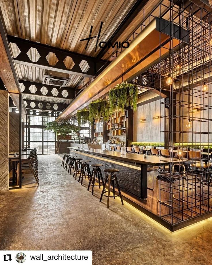 Contemporary Cafe Design Blends Industrial and Natural Elements for a Welcoming Atmosphere