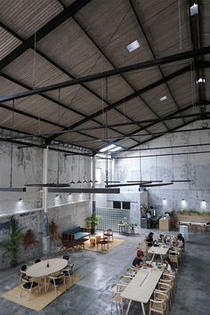 Contemporary Cafe with Spacious Industrial Design and Inviting Atmosphere