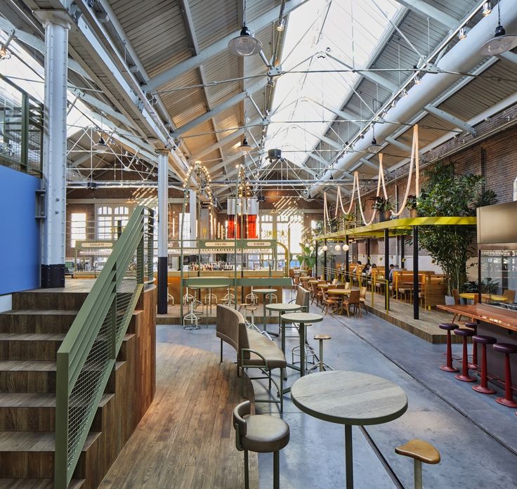 Inviting Industrial Cafe Design with Spacious Layout and Natural Aesthetic