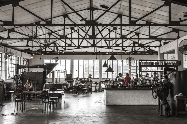 Spacious Industrial Cafe Blends Vintage and Modern Aesthetics for an Inviting Atmosphere