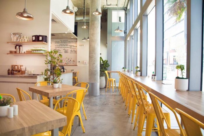 Modern Cafe Design: A Lively Fusion of Industrial Elements and Natural Light