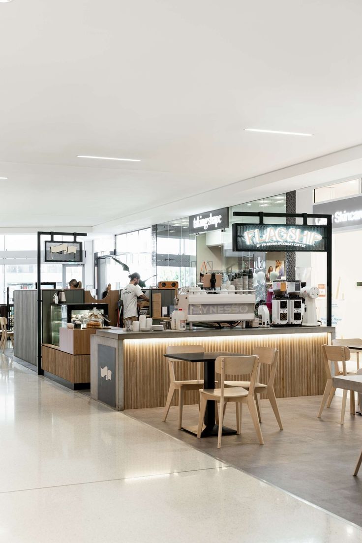 Contemporary Minimalist Cafe Design Emphasizing Natural Light and Inviting Atmosphere