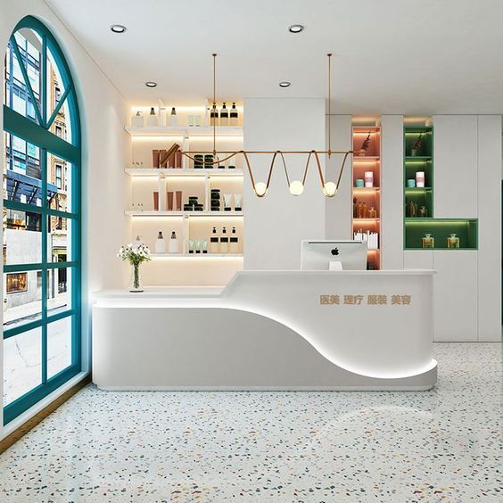 Modern Cafe Design: Elegant White Counter and Vibrant Turquoise Accents Create an Inviting Atmosphere