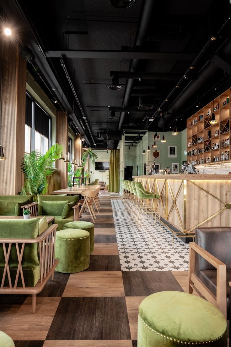 Contemporary Cafe Design: A Cozy Blend of Warm Woods, Green Upholstery, and Modern Aesthetics