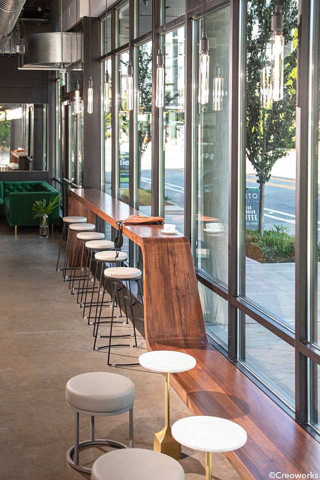 Modern Cafe Design Merges Natural Light, Warm Wood, and Industrial Elements for an Inviting Atmosphere