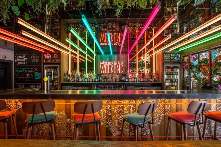 Vibrant Cafe Design: A Modern Aesthetic with Striking Neon Lighting and Inviting Atmosphere