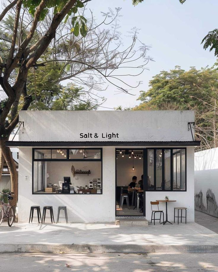 Modern Minimalist Cafe: A Serene Retreat with Inviting Design and Outdoor Seating