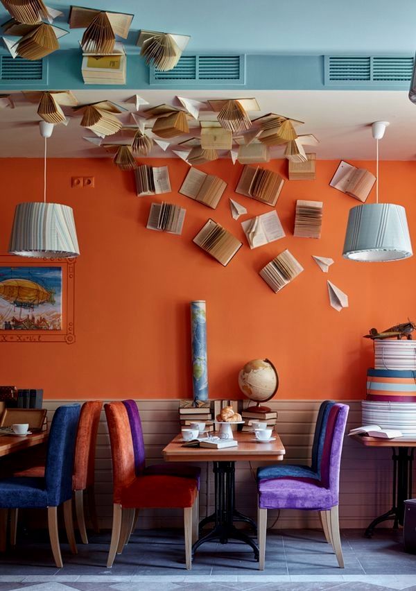 Vibrant Cafe Design Blending Warmth and Whimsy with Literary Accents