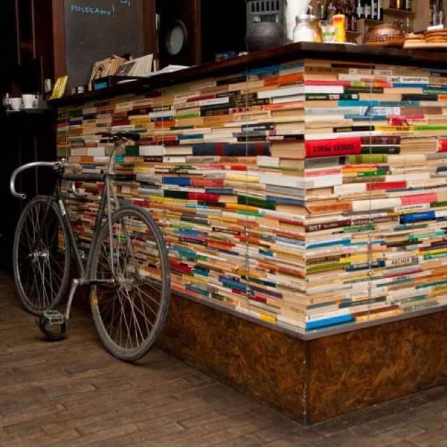 Eclectic Cafe Design Showcases a Striking Stacked Book Bar and Cozy Literary Vibe