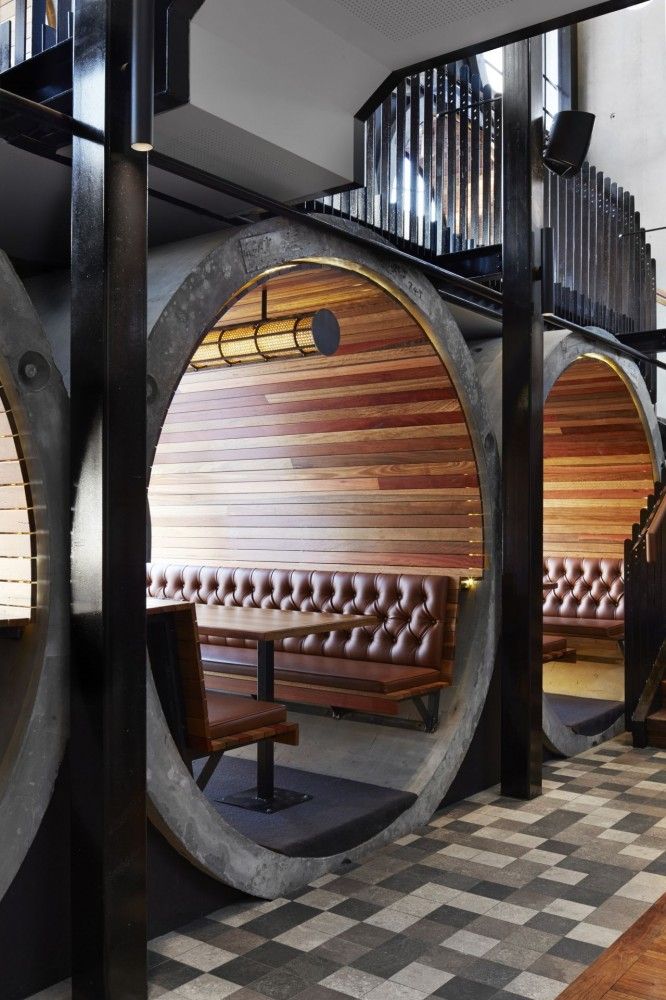 Inviting Cafe Design: Unique Circular Booths, Warm Materials, and Abundant Natural Light