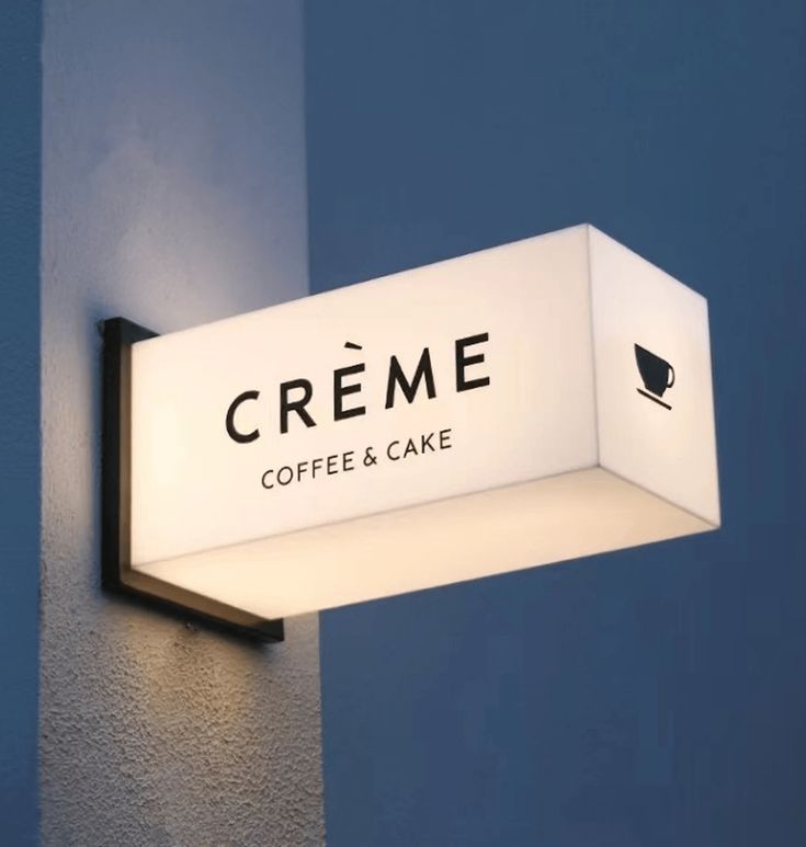 Sleek Modern Cafe Sign Blends Minimalism with Warm Ambiance