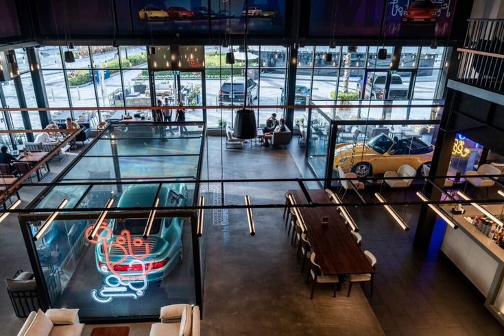 Modern Cafe Design: A Stylish Fusion of Open Space, Unique Car Display, and Social Interaction