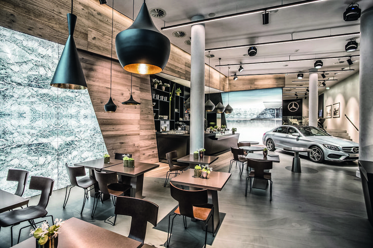 Modern Cafe Design: Harmonious Blend of Natural and Industrial Elements with Automotive Artistry