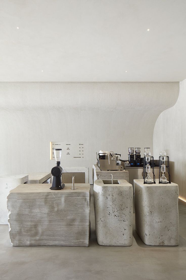 Sleek Minimalist Cafe Design Showcases Concrete Elements and Ambient Atmosphere