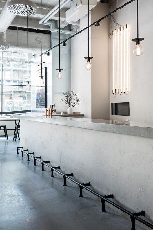 Minimalistic Cafe Design Emphasizing Light, Sophistication, and Casual Vibes