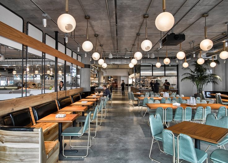 Modern Cafe Design Blending Warmth and Industrial Elements for Inviting Dining Experiences