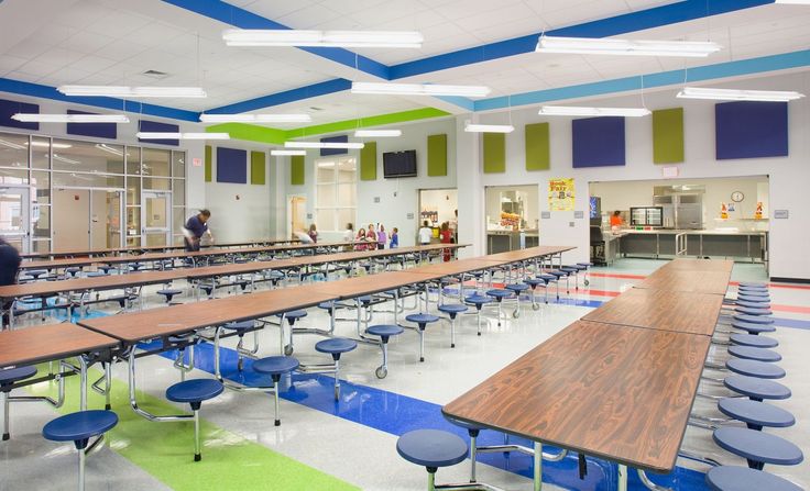 Welcoming and Vibrant Cafeteria Design with Spacious Layouts and Colorful Accents