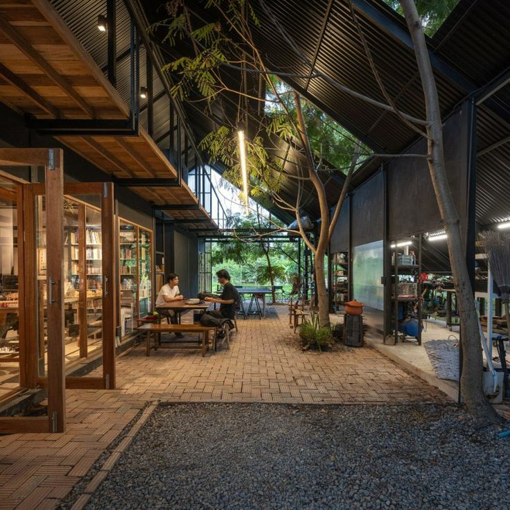 Modern Cafe Design: A Harmonious Fusion of Indoor-Outdoor Spaces with Natural Materials and Inviting Ambiance