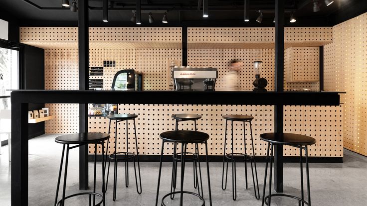 Modern Cafe Design: A Harmonious Blend of Black and Light Wood Elements