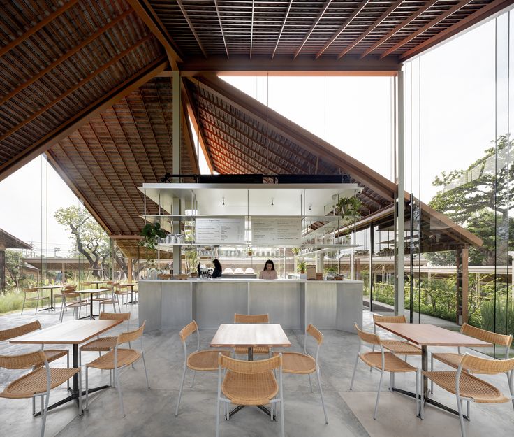 Spacious Cafe Design Blending Natural Materials with Modern Aesthetics and Inviting Ambiance