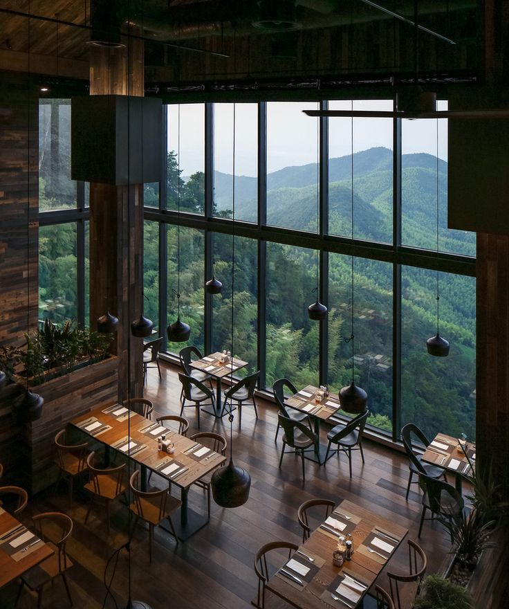 Inviting Cafe Design Featuring Open Layout and Natural Materials with Stunning Mountain Views