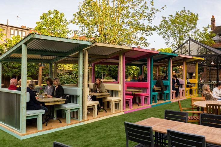 Charming Cafe Design with Vibrant Outdoor Seating and Garden Ambiance for Inviting Gatherings