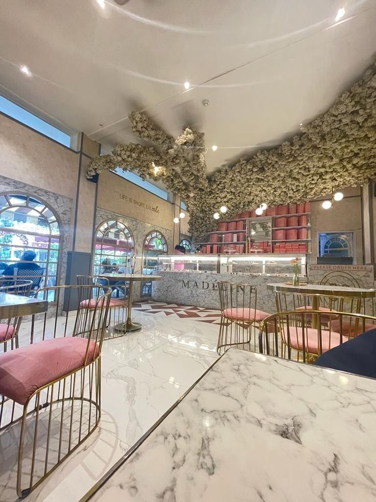 Elegant Modern Cafe Design with Pastel Tones and Natural Elements